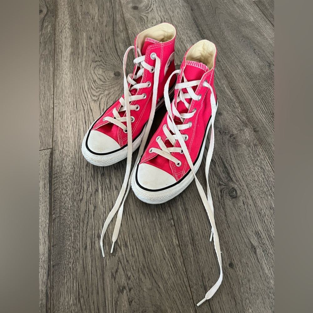 Women’s Pink Converse All Star High Tops.